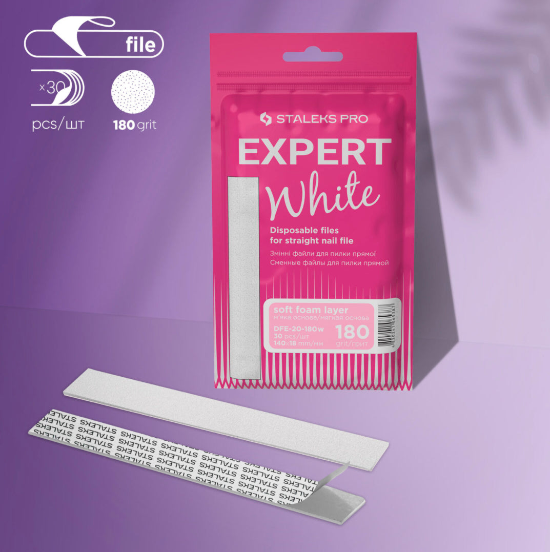 Staleks Pro Expert White disposable nail file refills 180 grit, 30 pack on purple background.
