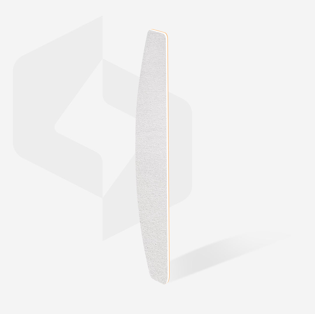 Curved white nail file for professional manicure on a light background