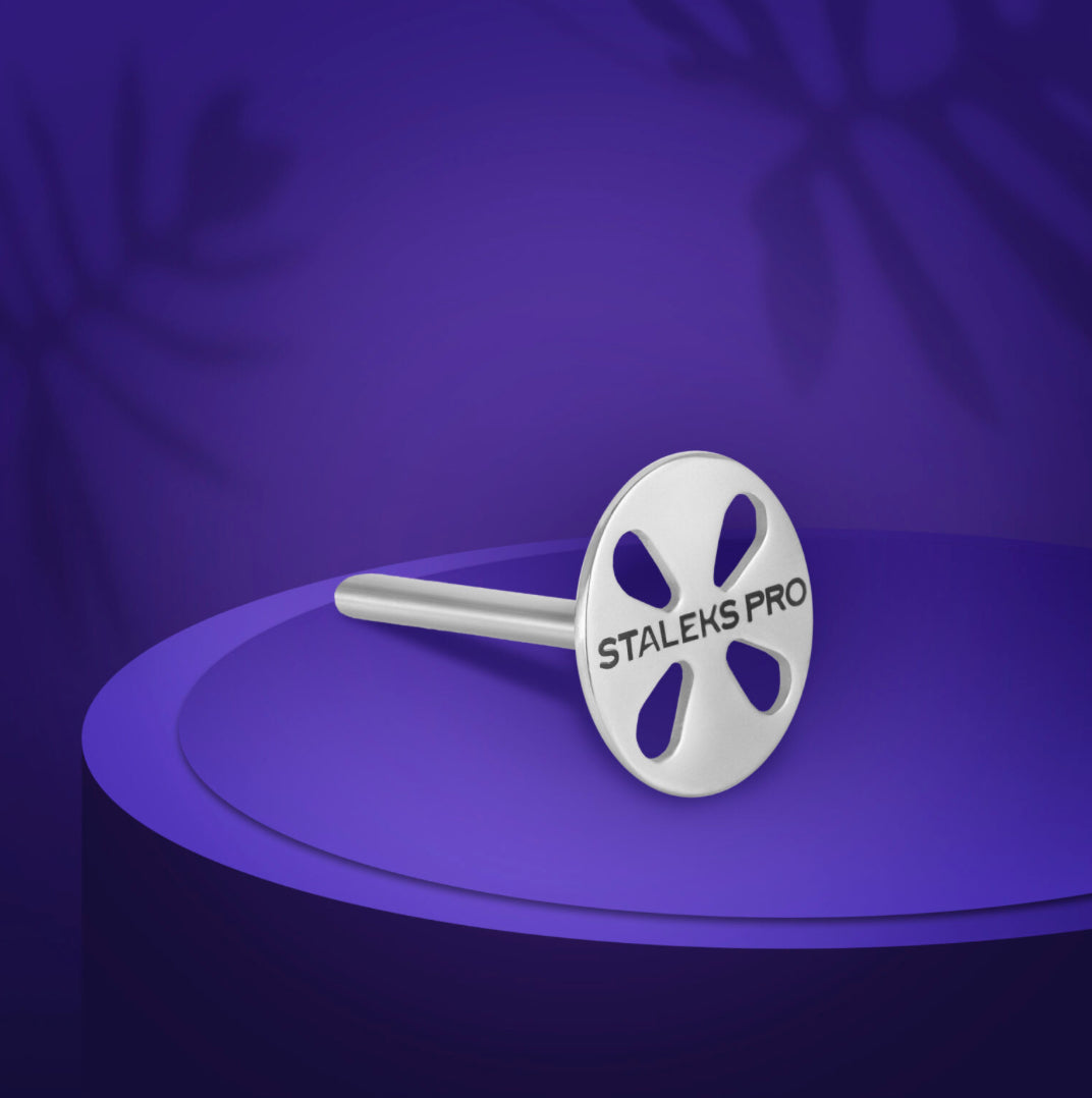 Staleks Pro metal manicure bit for nail drill on purple display background