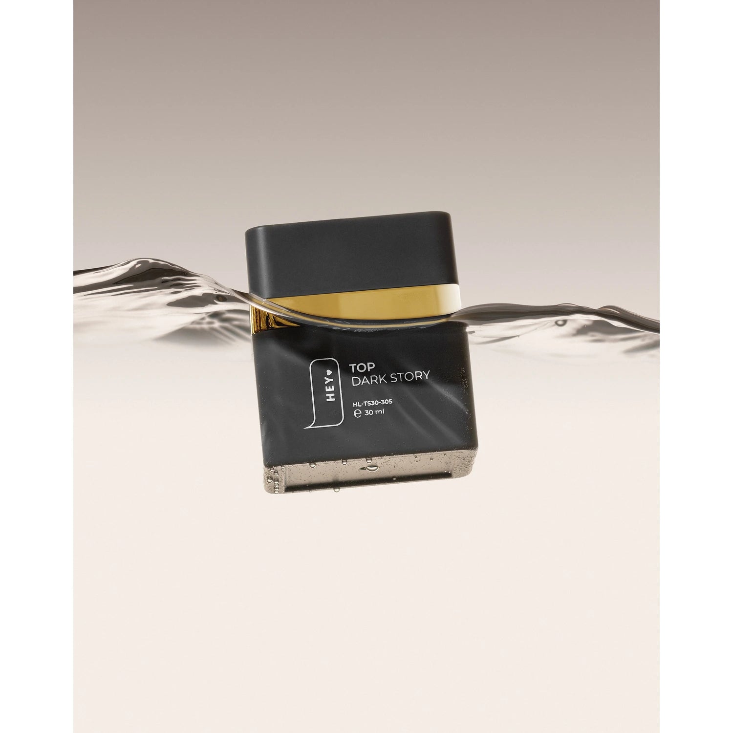 Black and gold nail top coat bottle partially submerged in water, labeled Top Dark Story