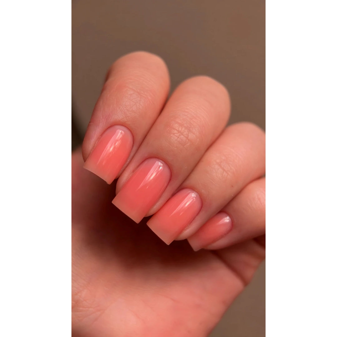 Manicure with DARK PRO Base 82 – orange color base on square-shaped nails