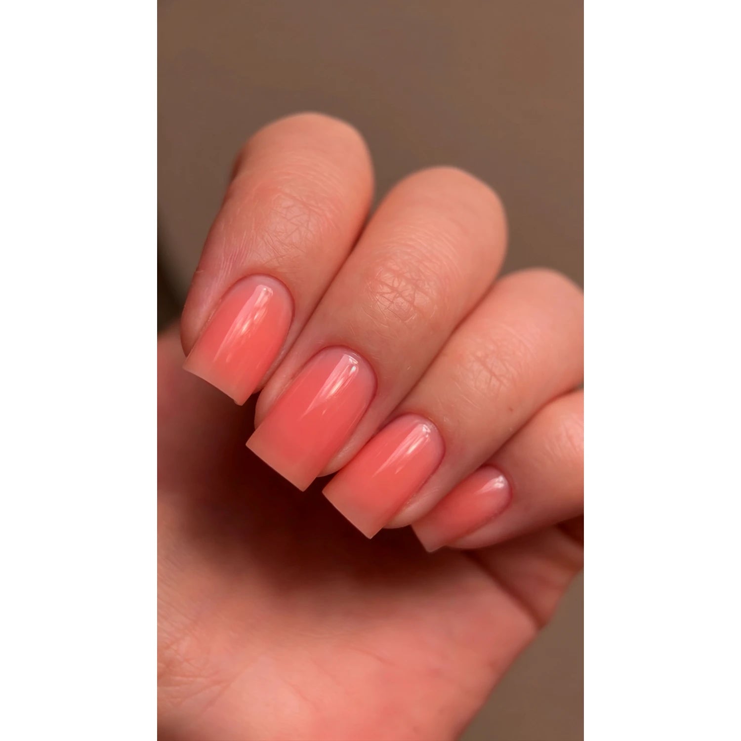 Manicure with DARK PRO Base 82 – orange color base on square-shaped nails