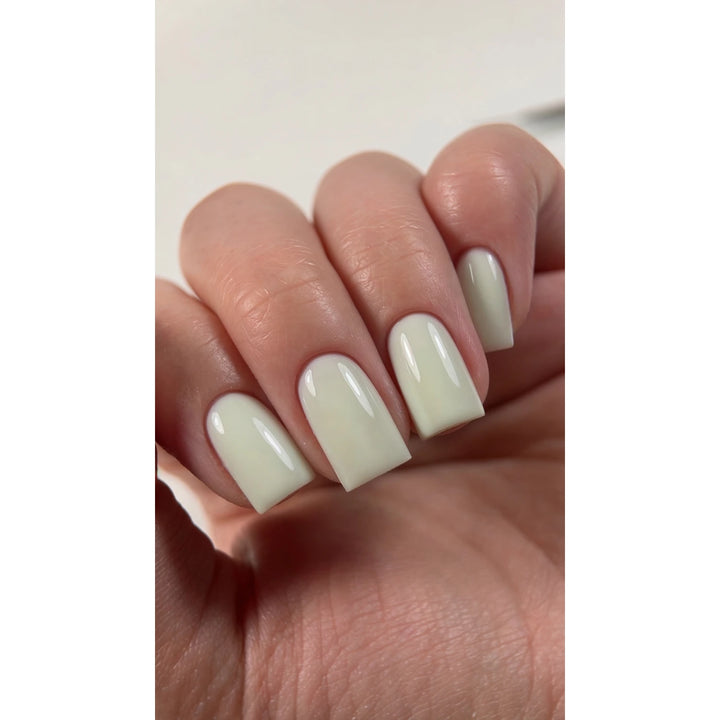 Manicure with DARK PRO Base 83 – soft pastel  green color base on square-shaped nails