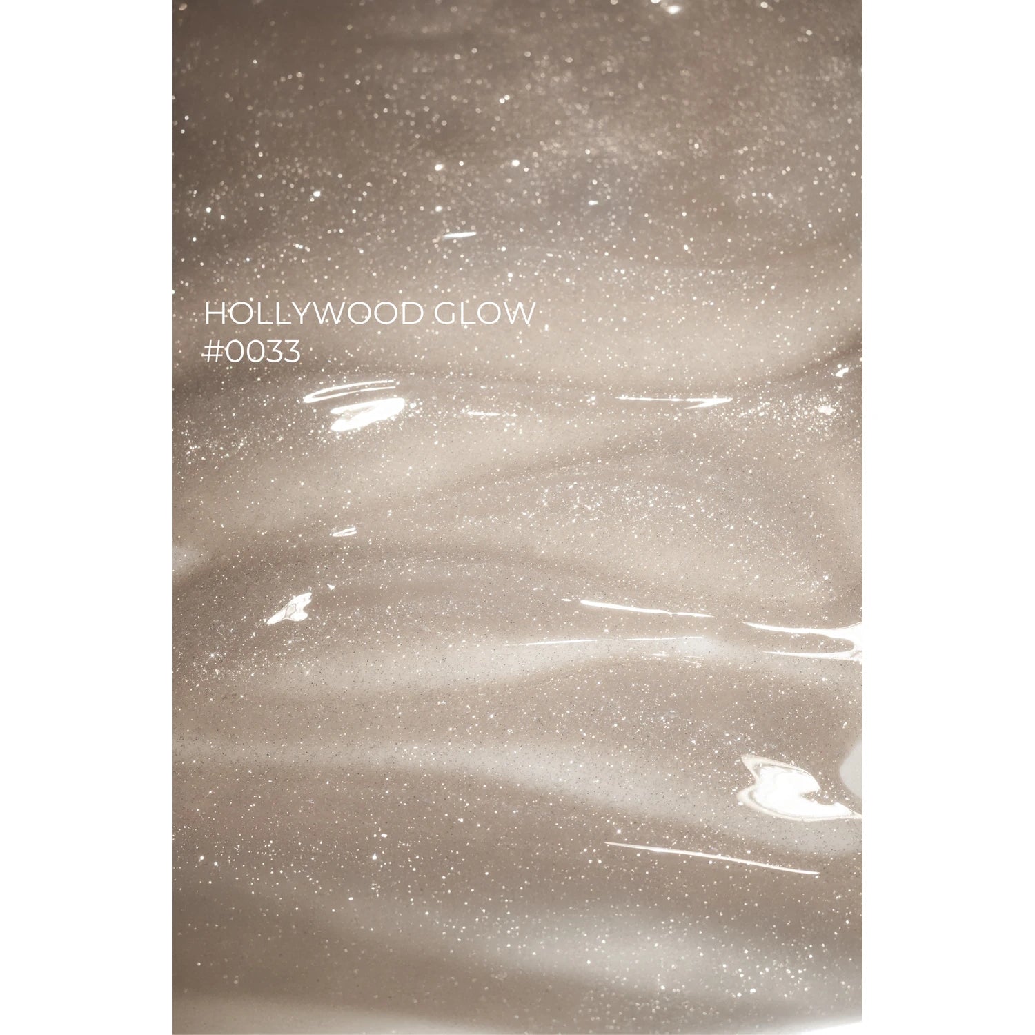 Shimmery nude gel nail polish with fine glitter, labeled HOLLYWOOD GLOW #0033