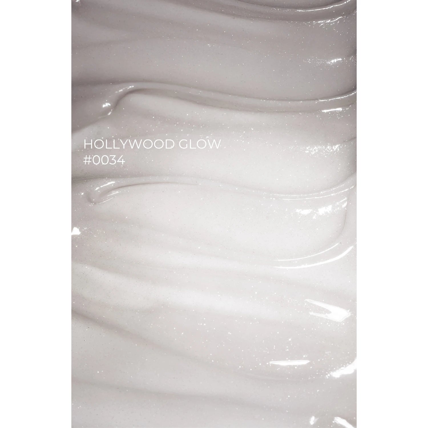 Shimmery white UV gel nail polish texture, labeled Hollywood Glow #0034, manicure product
