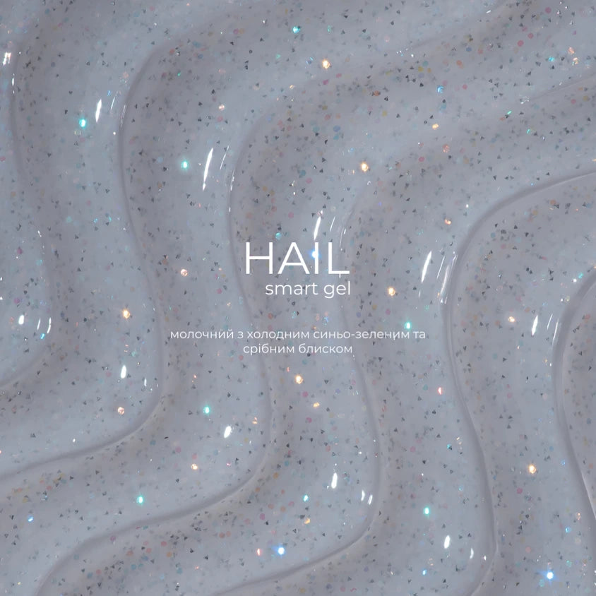 Milky white nail gel with silver and blue-green glitter, glossy manicure texture