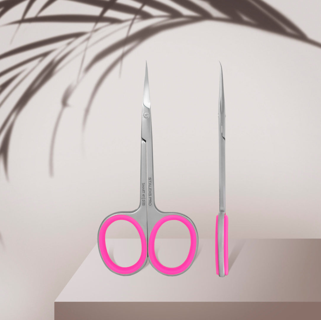 Stainless steel nail scissors with pink handles for manicure and pedicure on display