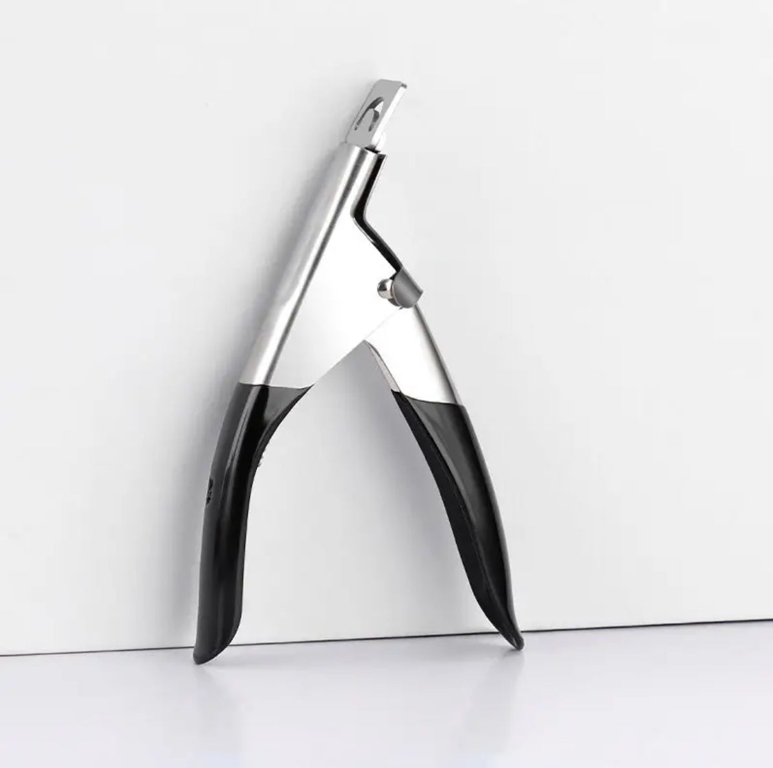Stainless steel nail tip clipper with black handles for manicure and acrylic nails