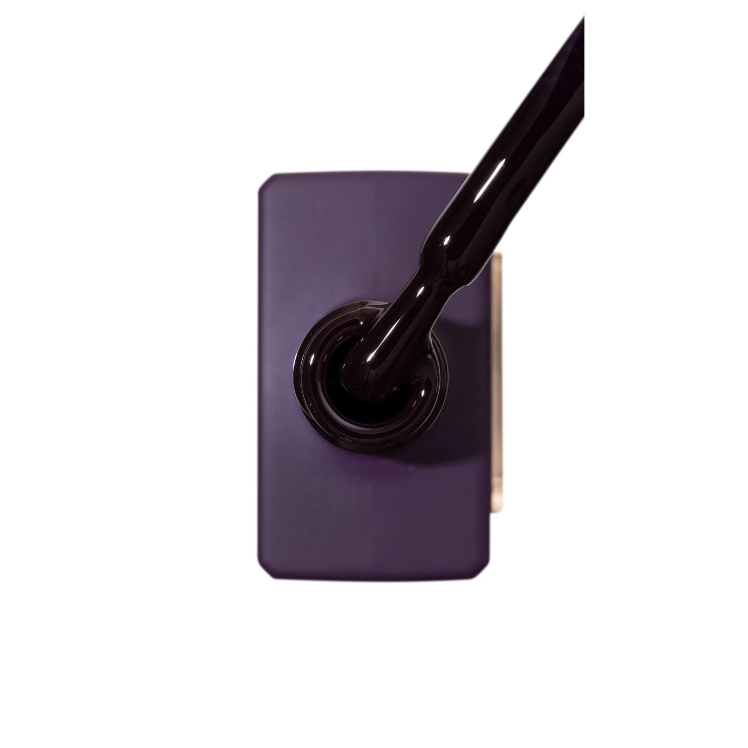 Dark purple gel nail polish bottle with brush applicator, professional manicure product
