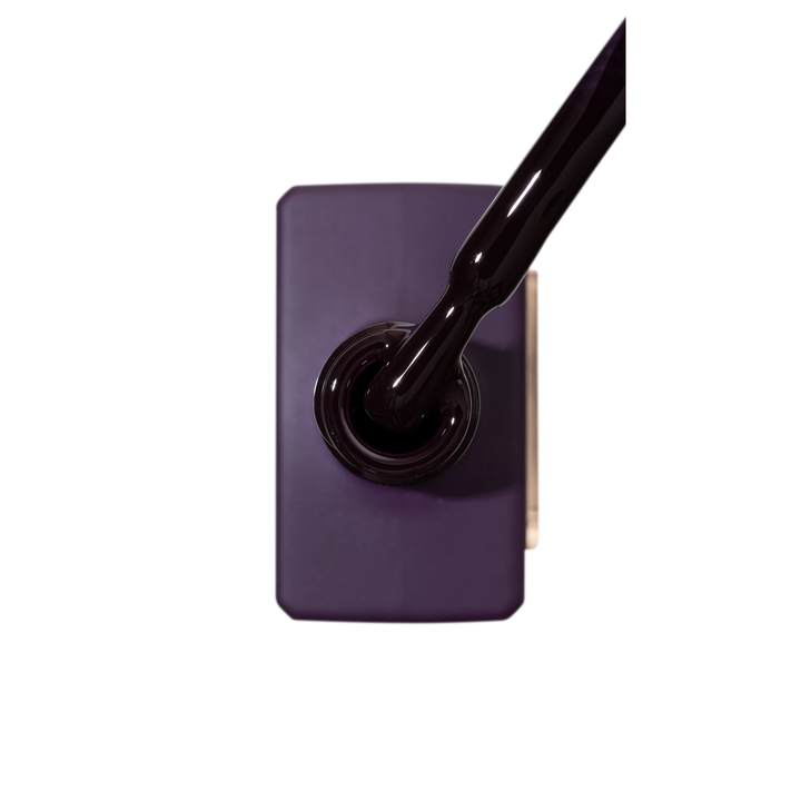 Dark purple gel nail polish bottle with brush applicator, professional manicure product