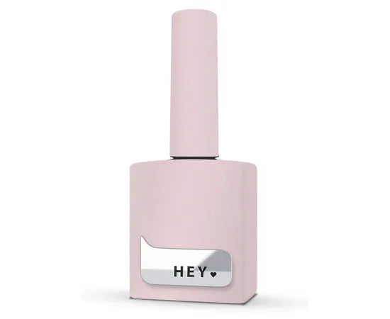 Light pink gel nail polish bottle with silver label and heart, manicure product