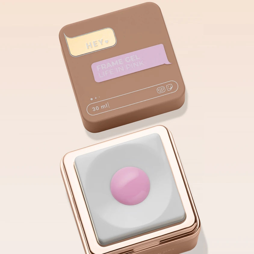 Pink UV gel nail polish in a stylish brown and gold container, lid labeled 'Frame Gel Life in Pink', 30ml.