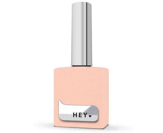 Peach nail polish bottle with silver cap and 'HEY' label, professional manicure product