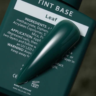 Dark green tinted nail gel polish sample displayed on product bottle with ingredients label