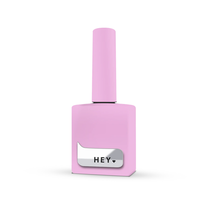 Light pink nail polish bottle with HEY label for manicure and pedicure