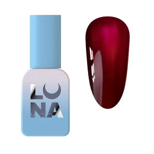 Red gel polish swatch next to blue bottle for professional manicure