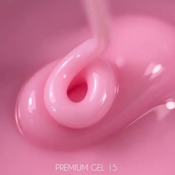 Close-up of pink UV gel for nails, glossy texture, labeled Premium Gel 15