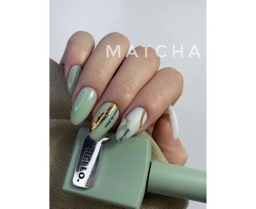 Green matcha-inspired gel manicure with gold leaf accents and nail art details