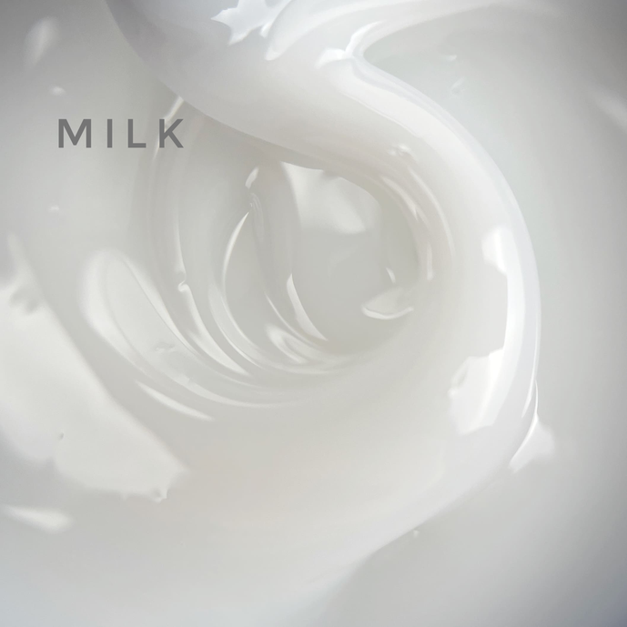 Milky white UV gel polish texture swirl for nails with 'MILK' text overlay.