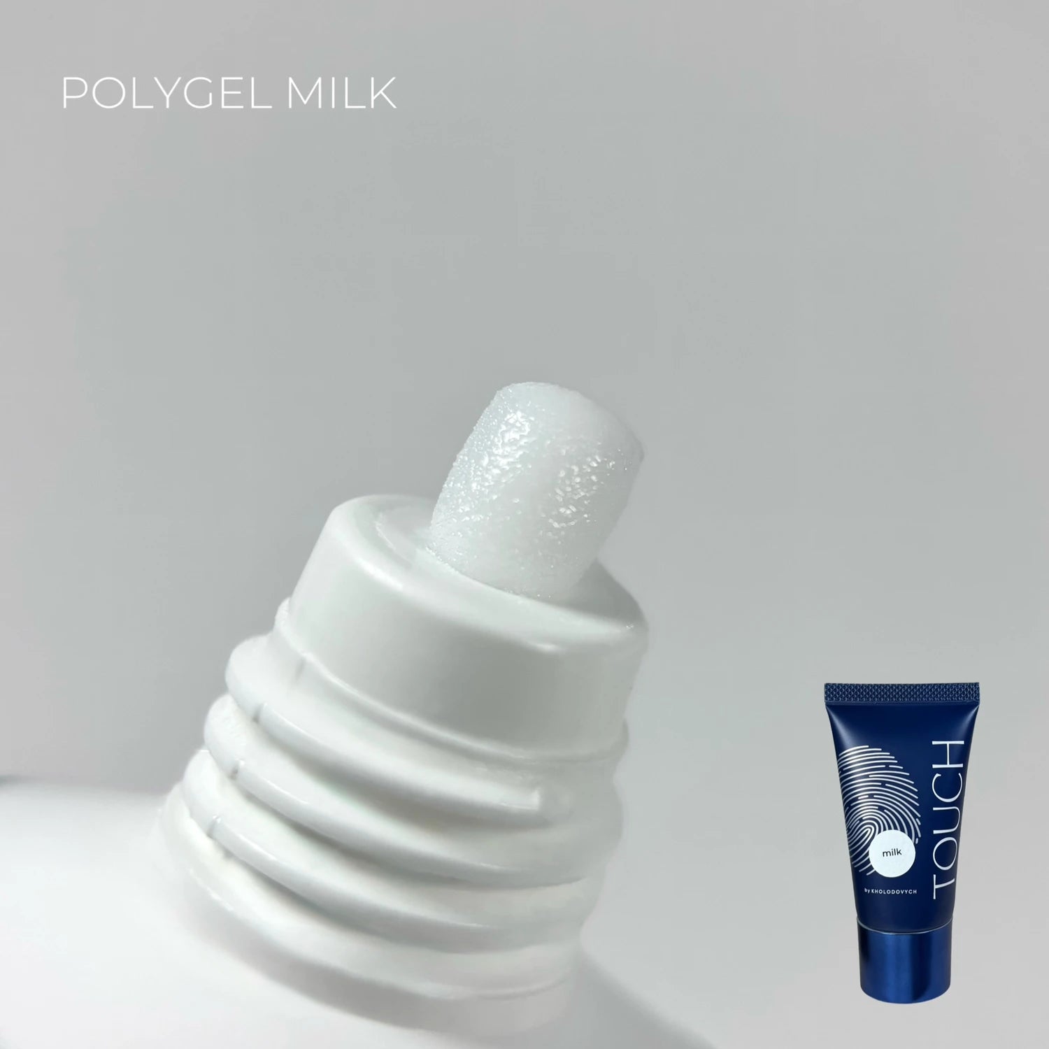 Close-up of white polygel milk nail gel tube with product texture visible, manicure supplies