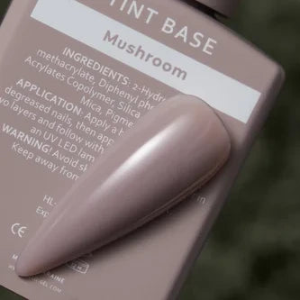 Mushroom tinted gel nail polish sample on bottle, taupe nude manicure color