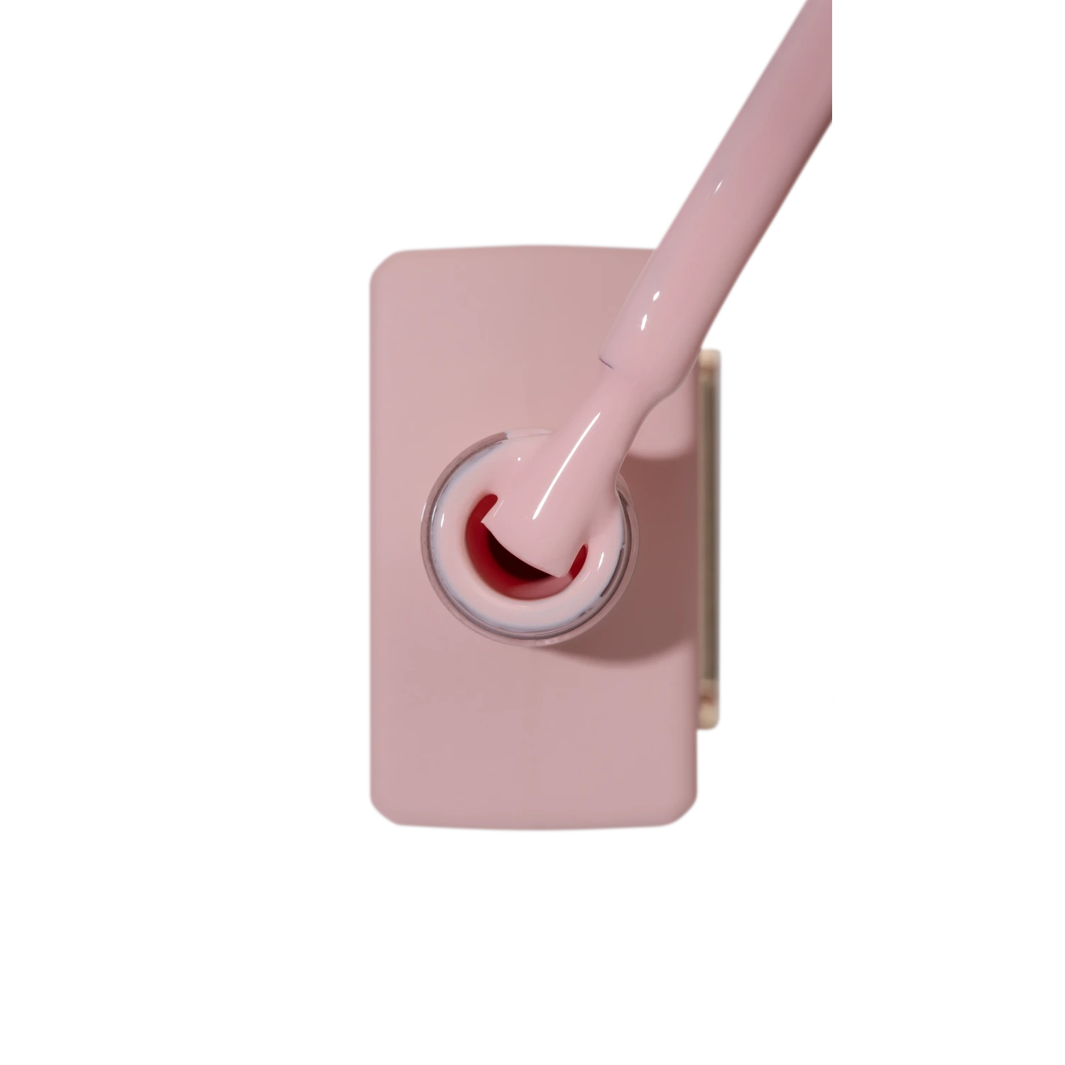 Peach pink gel nail polish bottle with applicator brush, professional manicure product