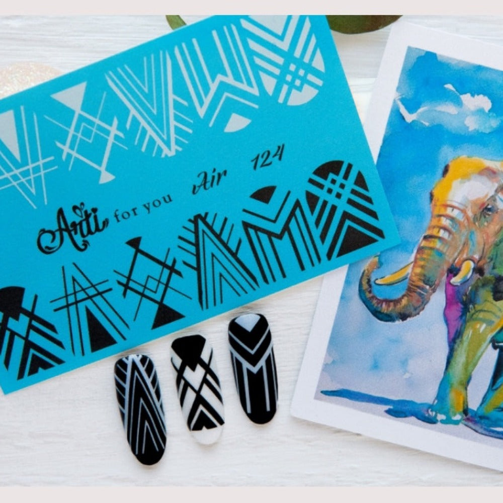Geometric nail art stencil sheet with black and white nail tips and colorful elephant art