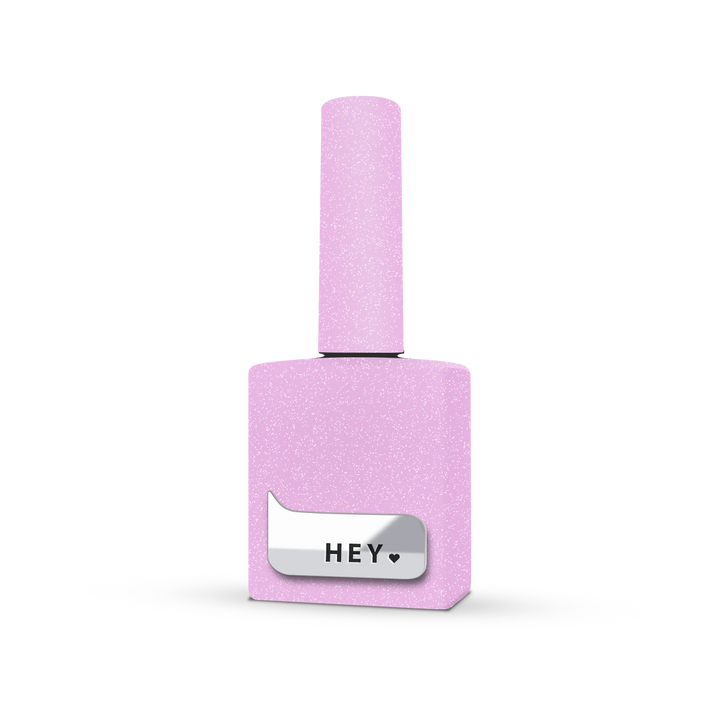Glitter pink nail polish bottle with silver label on white background