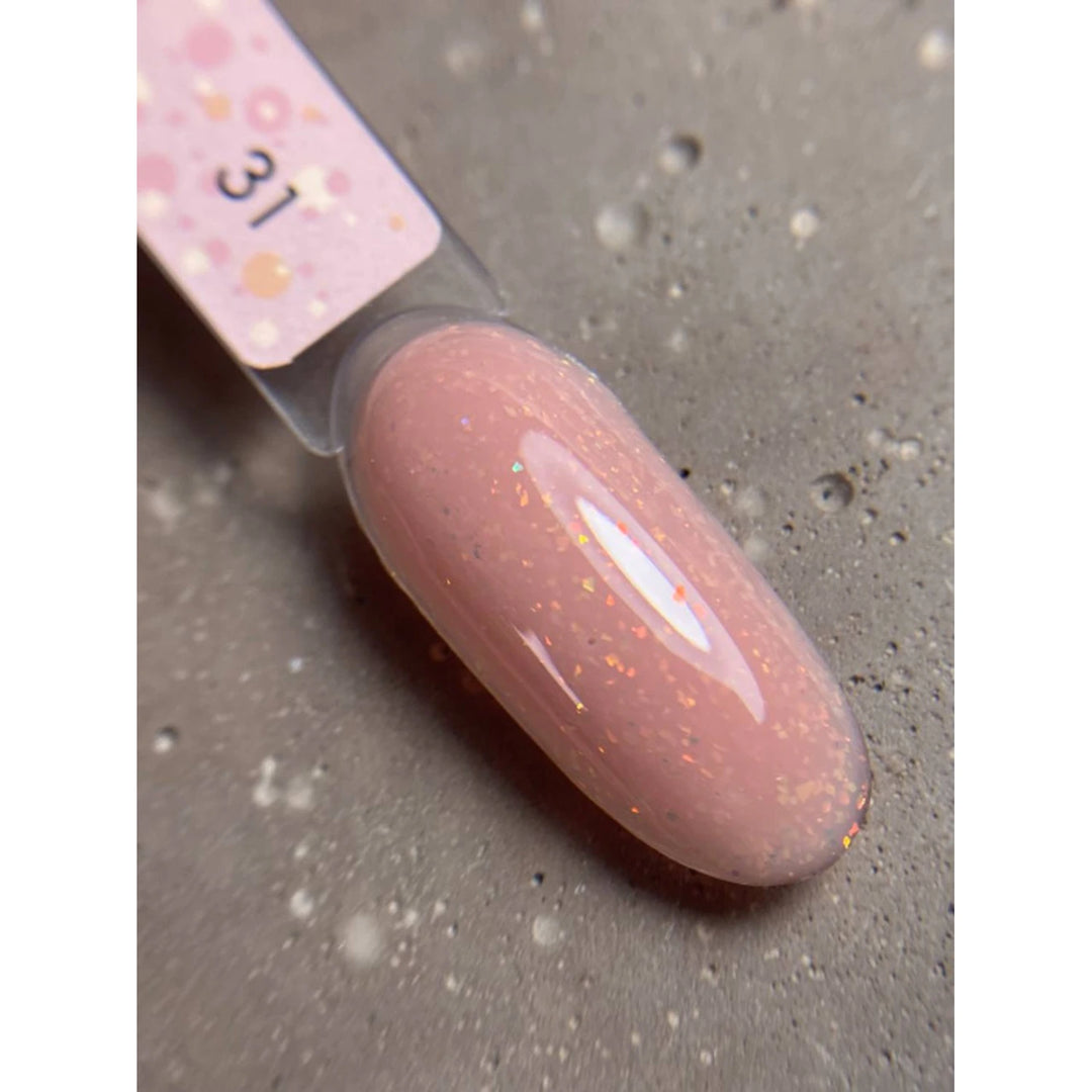 Swatch of pink glitter UV gel polish for nails on a sample stick