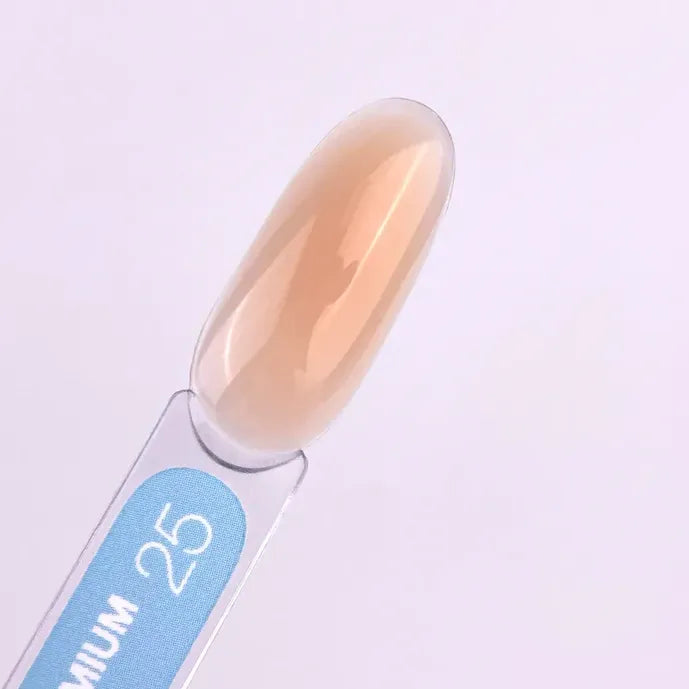 Nude beige builder gel swatch on clear nail display stick for manicure
