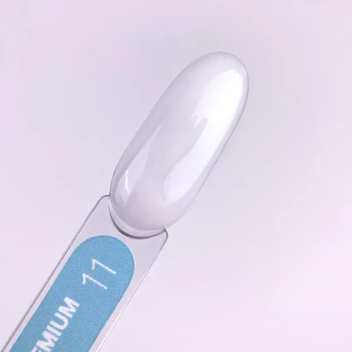 Swatch of glossy white builder gel for nails on a labeled display stick