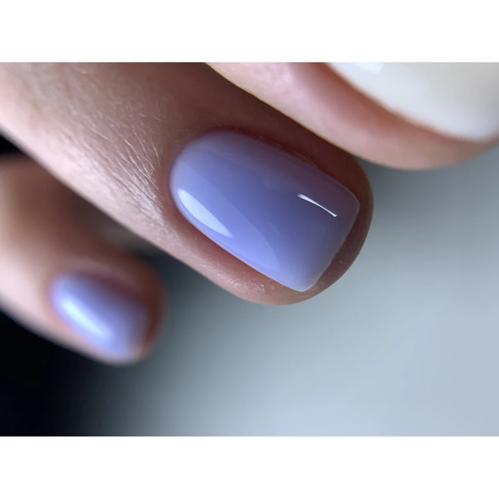 Close-up of nails with glossy lavender gel polish manicure