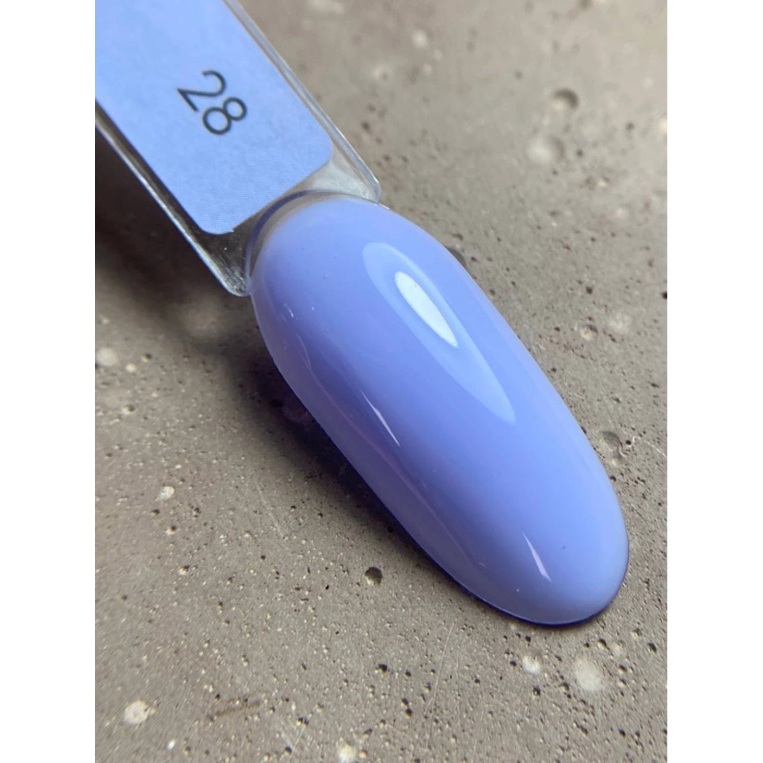 Light purple gel nail polish swatch on display stick, glossy finish, shade number 28