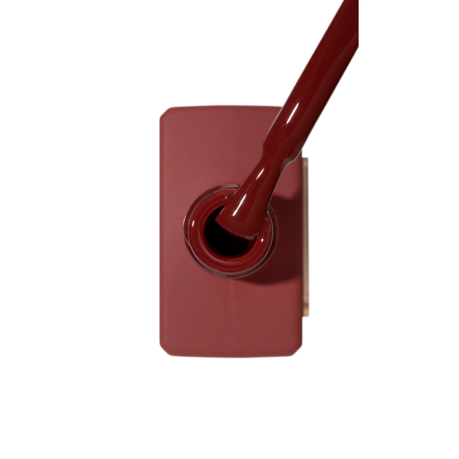 Reddish-brown gel nail polish bottle with brush, professional manicure product