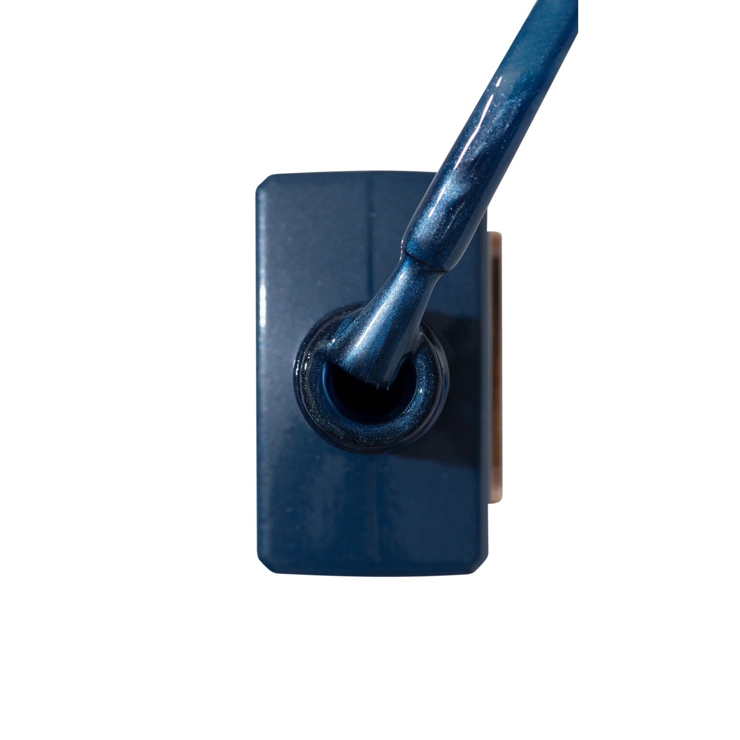 Blue shimmer UV gel nail polish bottle with applicator brush, top view
