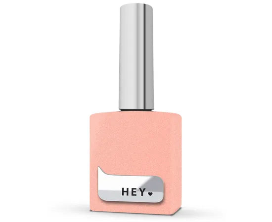 Peach-colored gel nail polish bottle with silver cap and 'HEY' label, manicure accessory