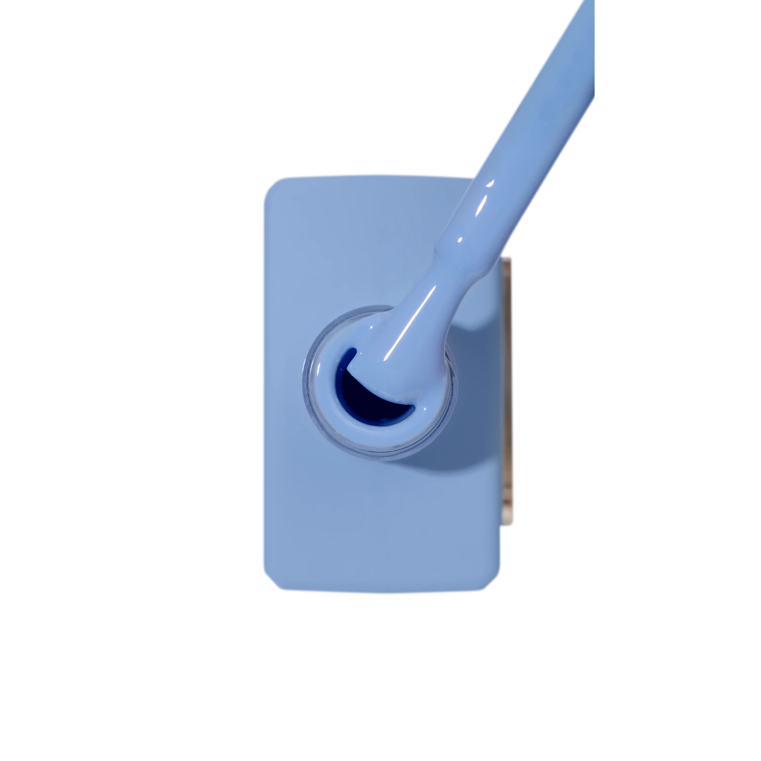 Light blue gel nail polish bottle with brush, manicure supplies