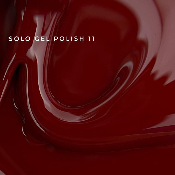 Glossy deep red gel nail polish closeup with 'Solo Gel Polish 11' text overlay.