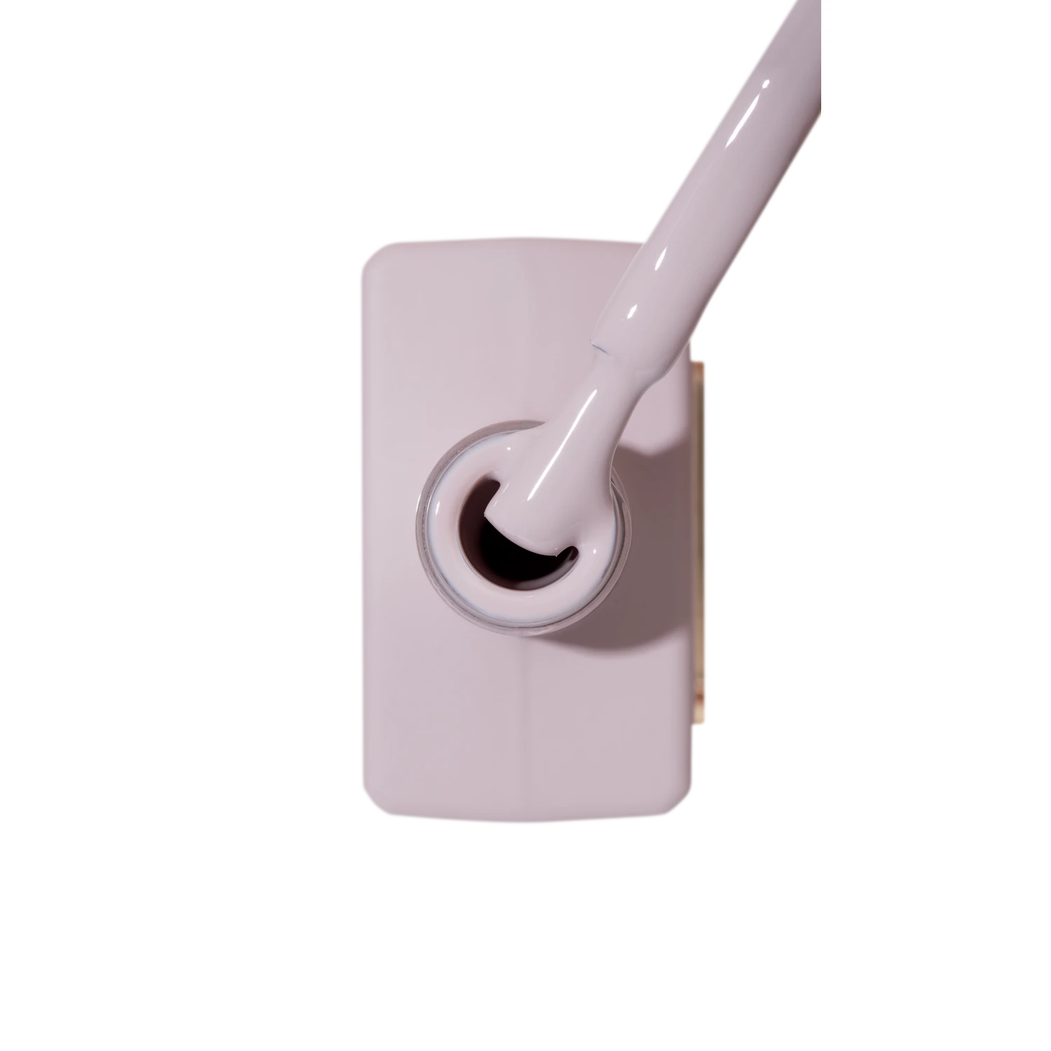 Light pink UV gel nail polish bottle with brush, professional manicure product