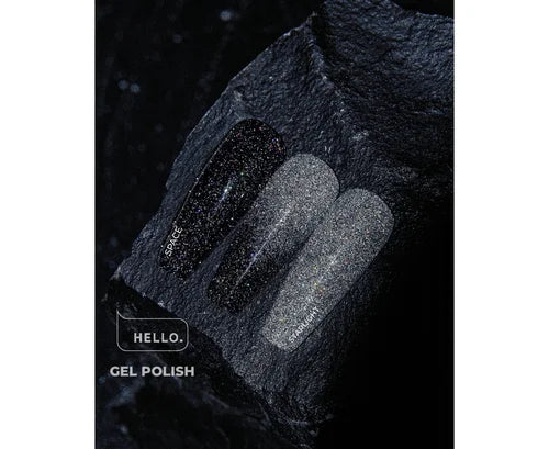 Three glitter gel polish nail samples in black and silver shades on a dark stone surface