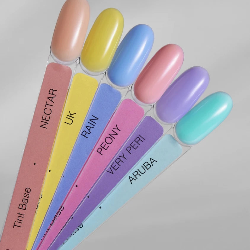 Six pastel color nail polish swatches labeled nectar, uk, rain, peony, very peri, aruba