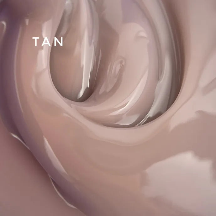 Glossy tan UV gel polish texture close-up, ideal for manicures and nail art designs