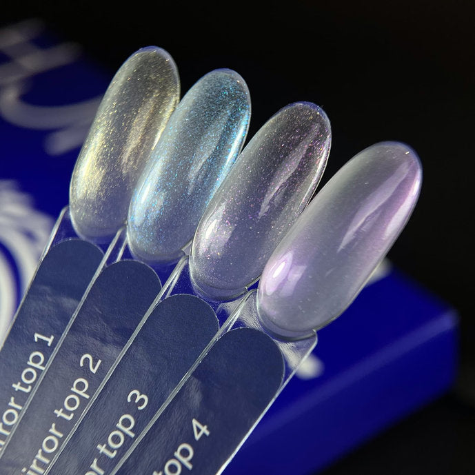 Four iridescent mirror effect nail polish swatches on clear sample sticks