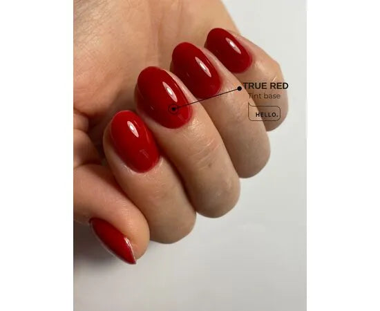 Hand with glossy true red gel nail polish, manicure, close-up