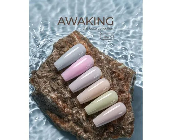 Pastel nail polish samples on a stone, displayed over water, tint base collection