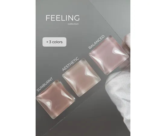 Three gel nail polish swatches in pink nude shades labeled Sunburnt, Aesthetic, Balanced on display card