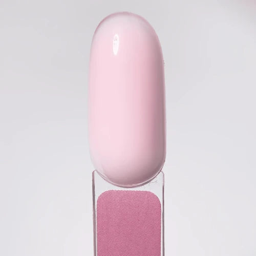 Glossy light pink gel nail polish swatch on clear display stick, perfect for manicure