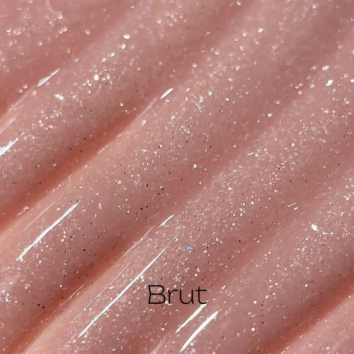 Shimmery pink glitter gel polish swatch for nails with glossy finish
