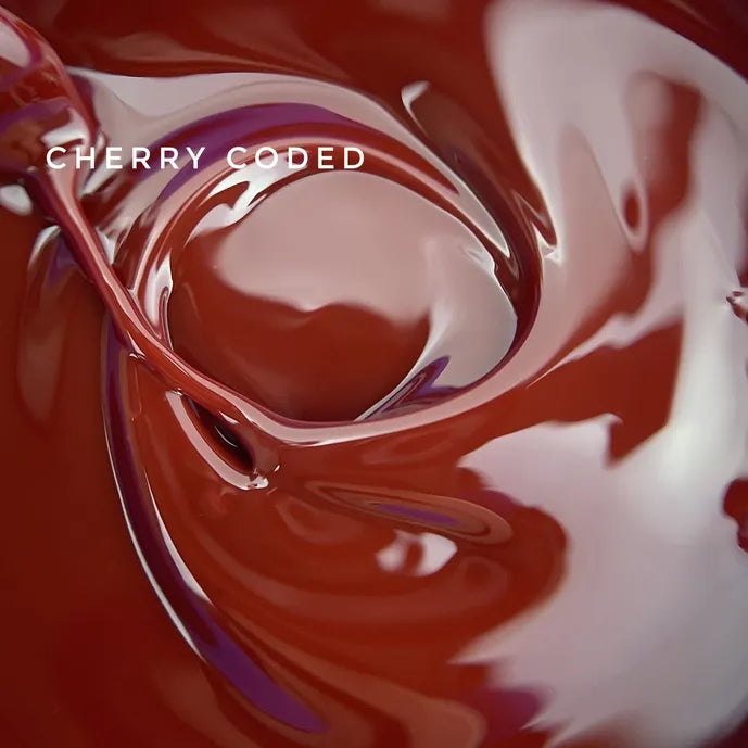 Glossy cherry red nail polish swirl, close-up, ideal for manicure and nail art design