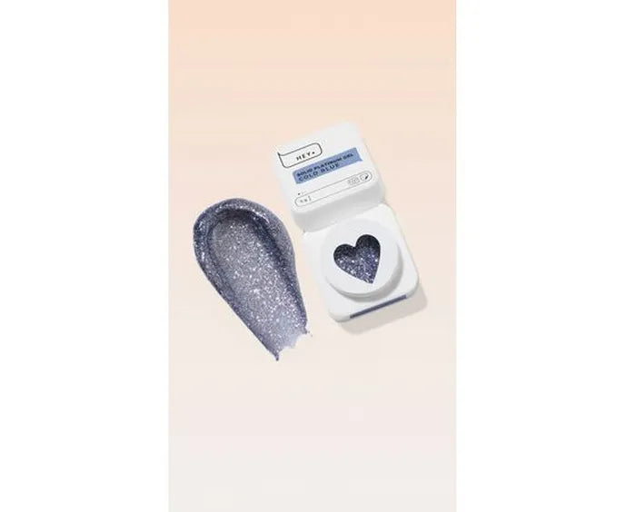 Shaving cream container with heart design and blue glittery lid on a light pink background. Brand: HEYLOVE